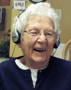 Elderly woman listening to music