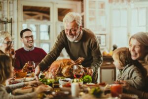 family-sits-down-for-Thanksgiving-dinner.jpg