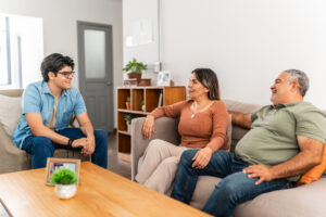 Happy family talking at home